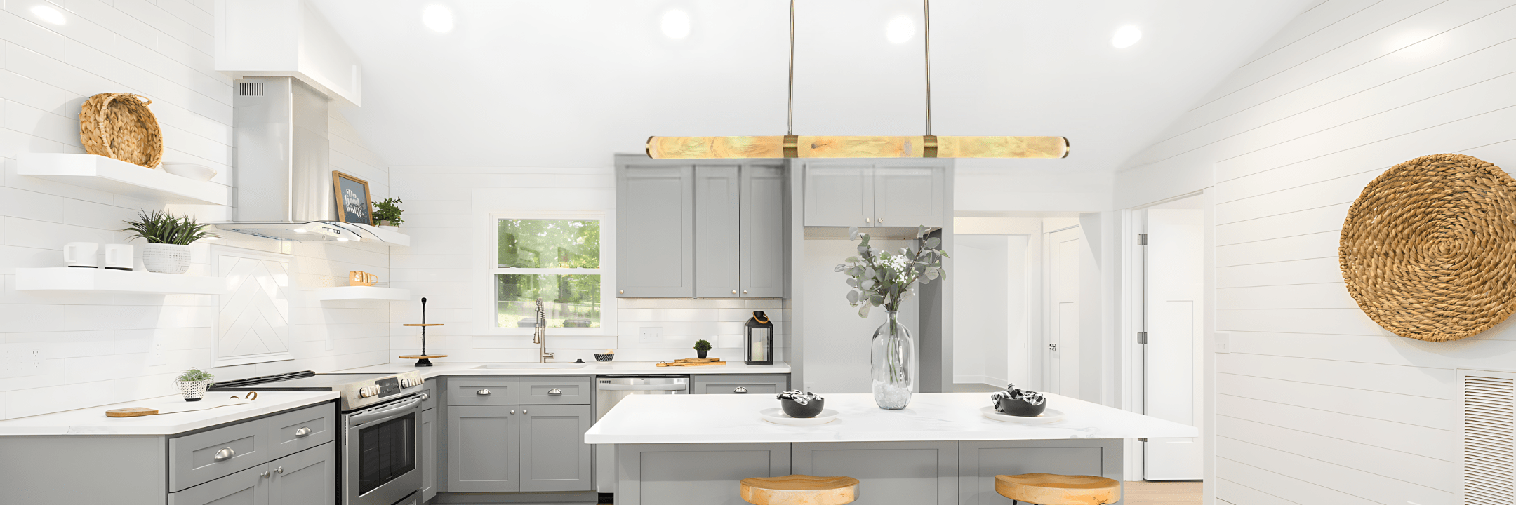 Modern linear pendant light fixture installed over a kitchen island in an Australian home.